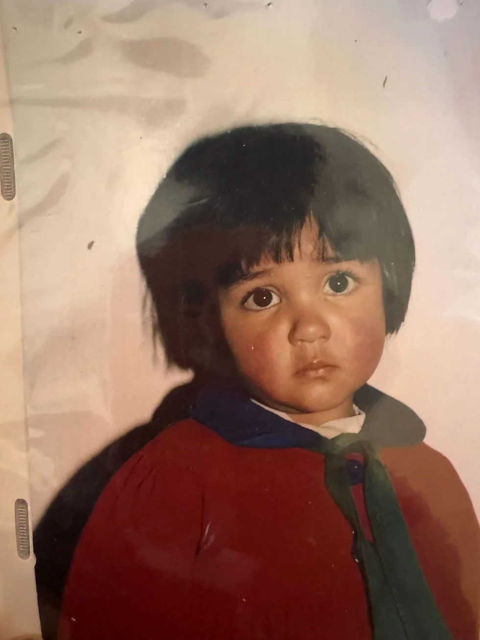 young child with red shirt on