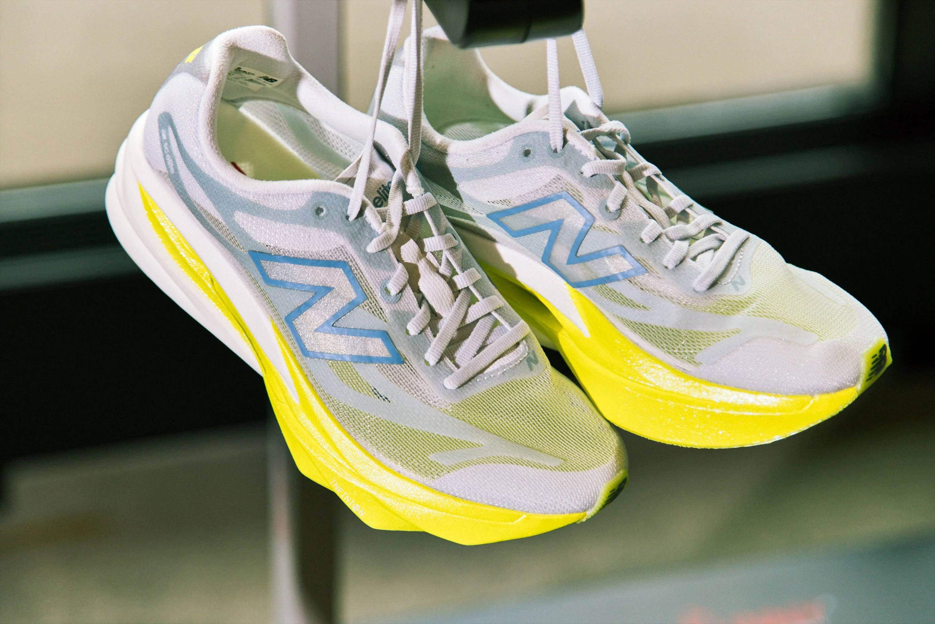 Lightweight running shoes with a gray and yellow design, showcasing a modern athletic style. Lightweight running shoes with a gray and yellow design, showcasing a modern athletic style.