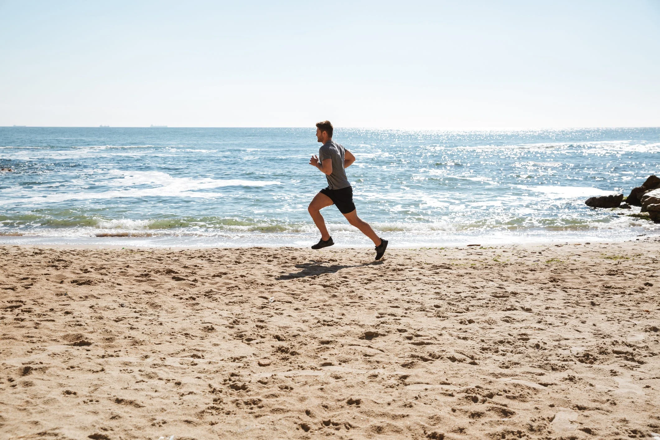 Running on the Beach Can Boost Your Fitness. Here’s How and Why to Hit the Sand This Summer, According to Experts