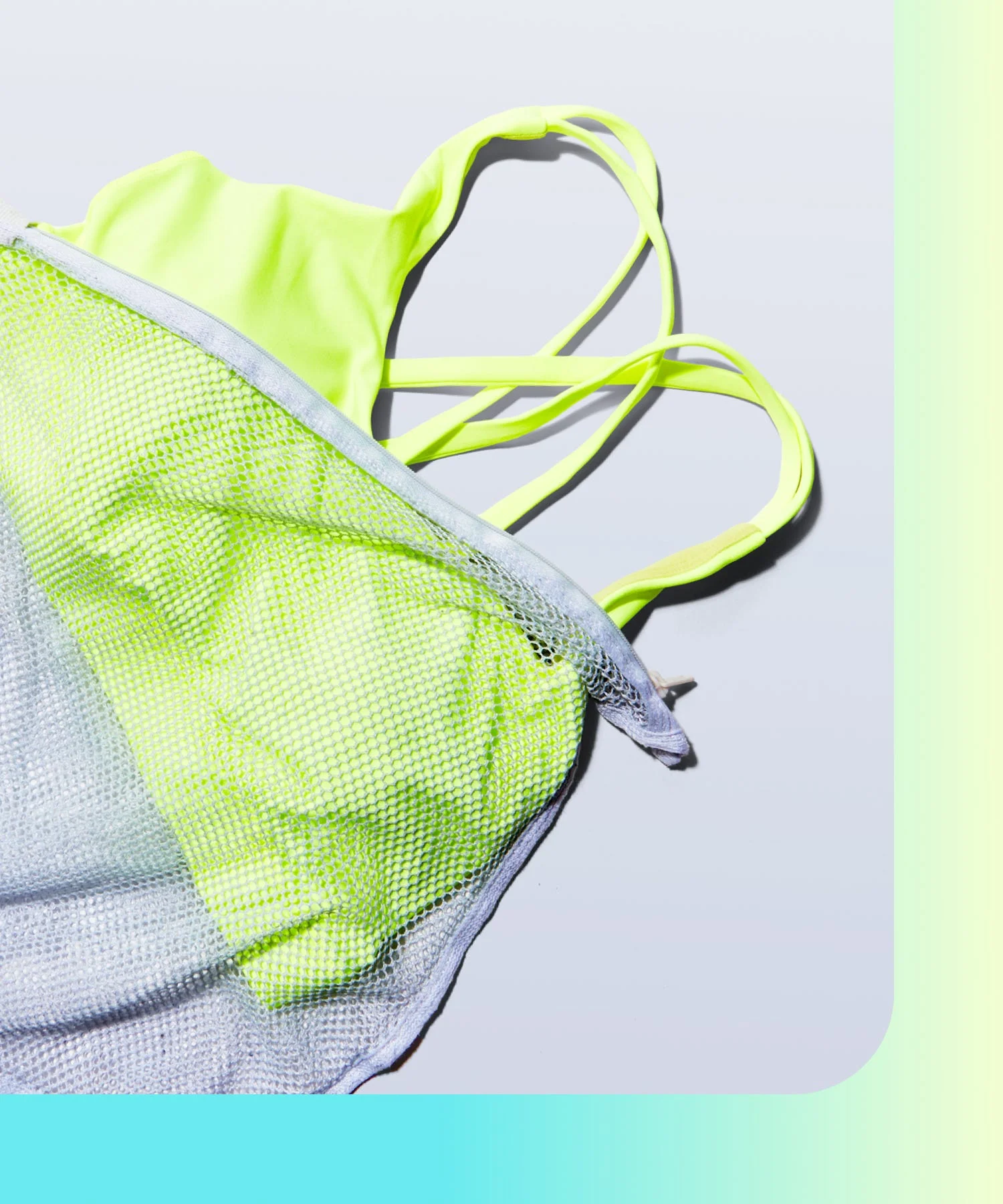 neon yellow sports bra in a mesh bag