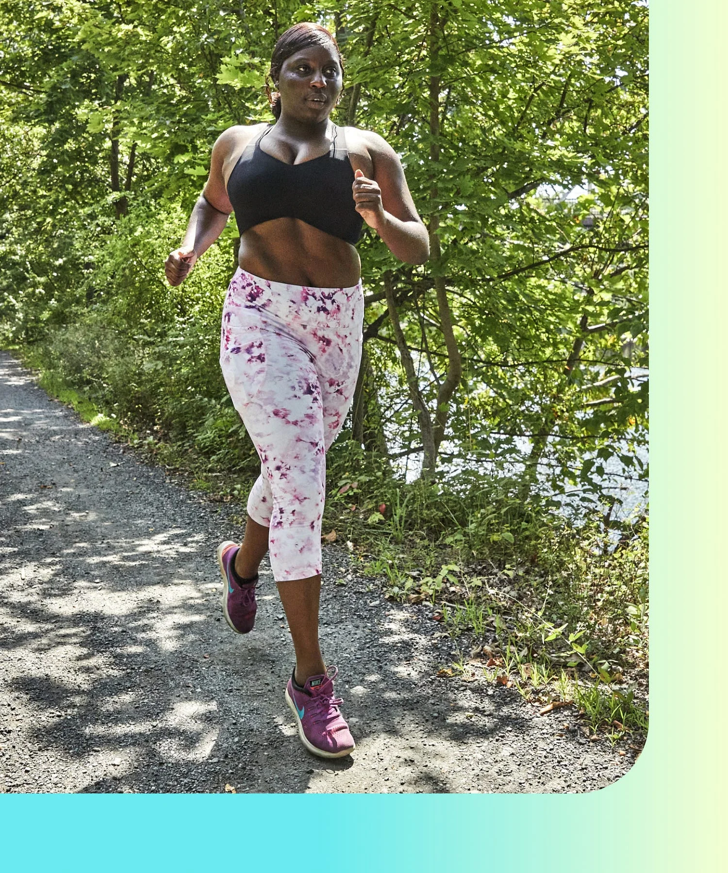 individual jogging on a path surrounded by greenery