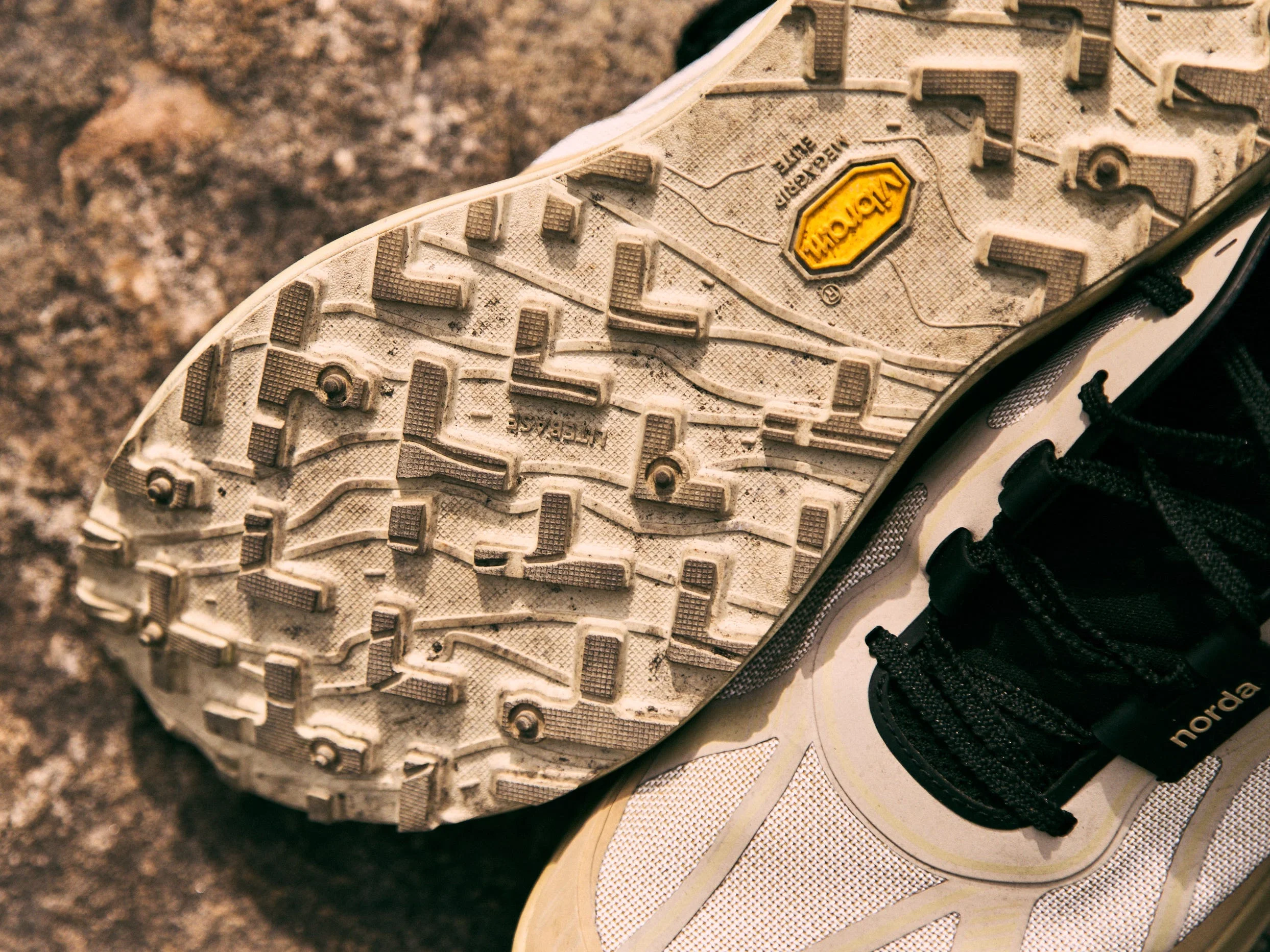 Close-up of the outsole of the norda 055 shoe sole showing tread pattern designed for grip and traction.