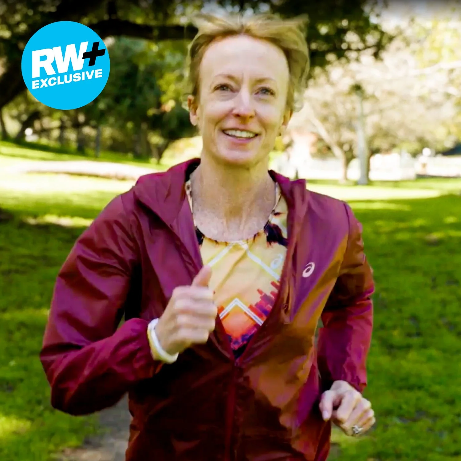 person jogging in a park wearing sports attire