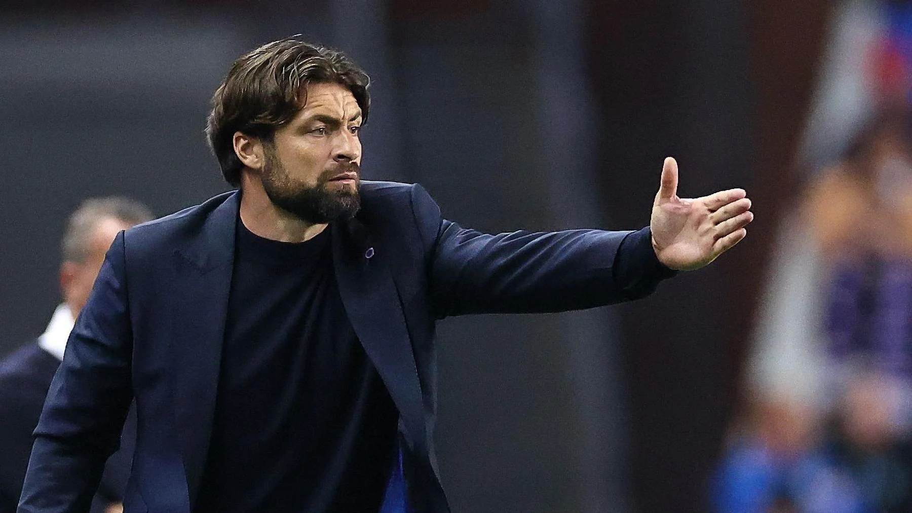 Russell Martin points directions to his Rangers players during a Champions League play-off game
